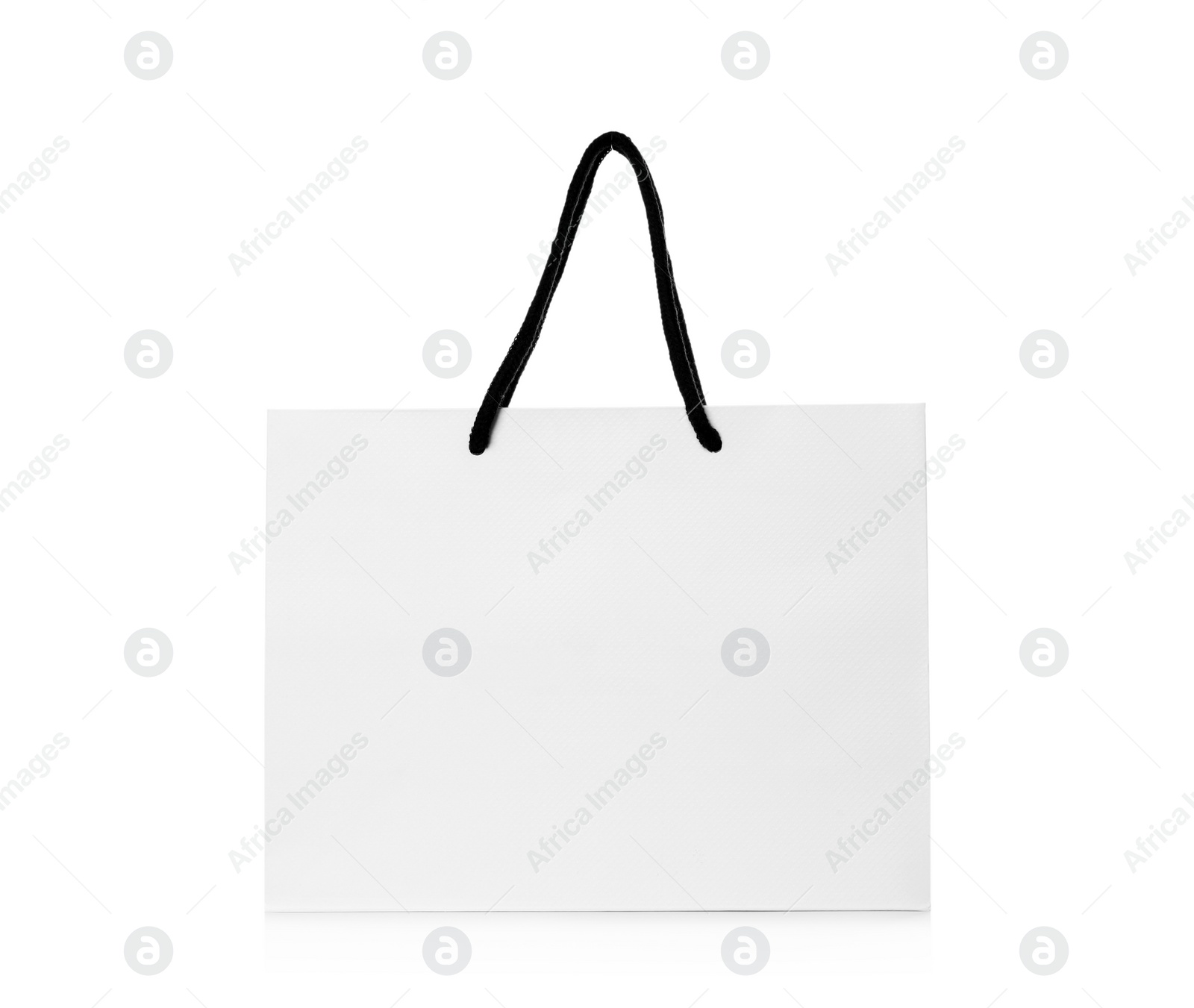 Photo of Paper shopping bag isolated on white. Mock up for design