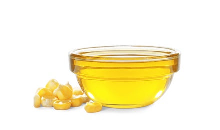 Photo of Bowl with fresh corn oil and kernels on white background