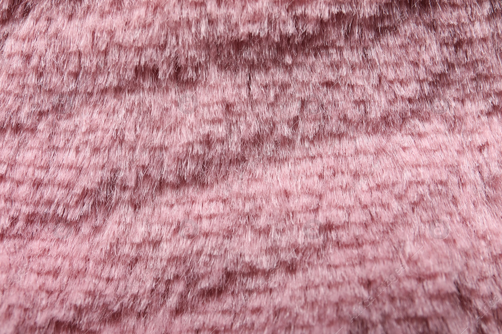 Photo of Texture of pink faux fur as background, closeup