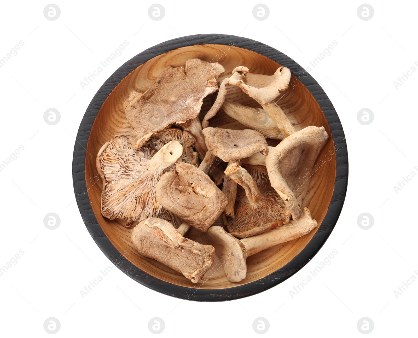 Photo of Plate of dried mushrooms isolated on white, top view