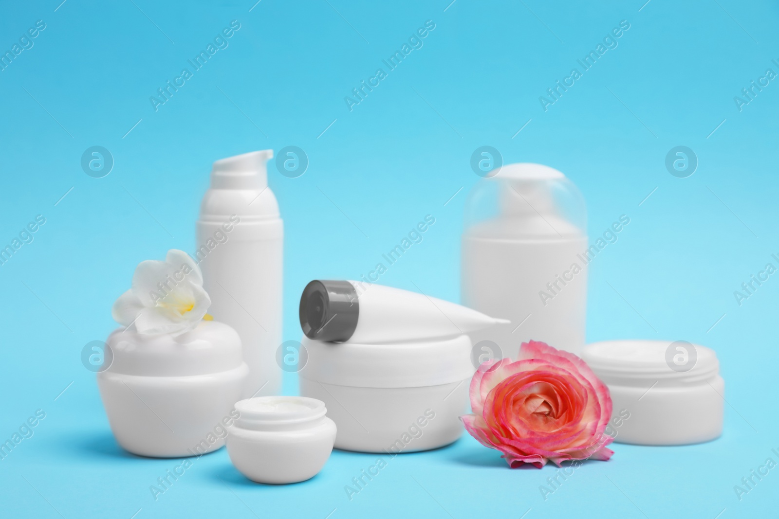 Photo of Composition with cosmetic products on color background