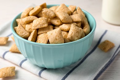 Photo of Delicious corn pads on white wooden table, closeup