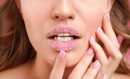Photo of Beautiful young woman with sugar lips, closeup