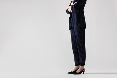 Photo of Businesswoman with crossed arms on white background, closeup