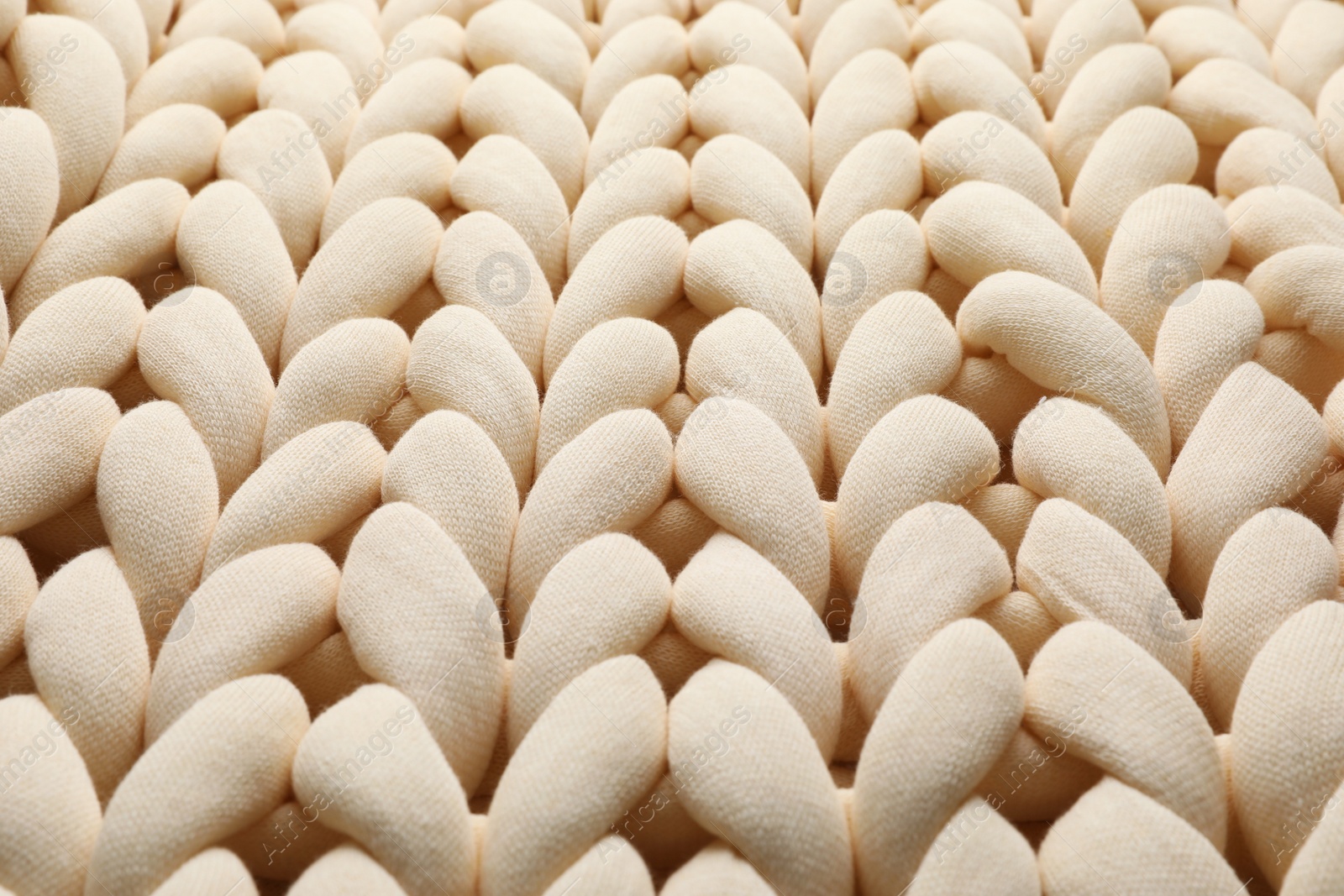 Photo of Chunky knit blankets as background, closeup view