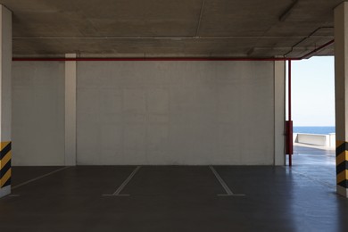 Empty open car parking garage on sunny day