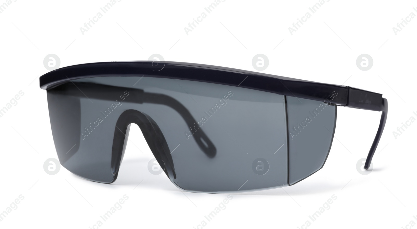 Photo of Protective goggles on white background. Construction tool