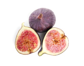 Whole and cut fresh figs isolated on white, top view