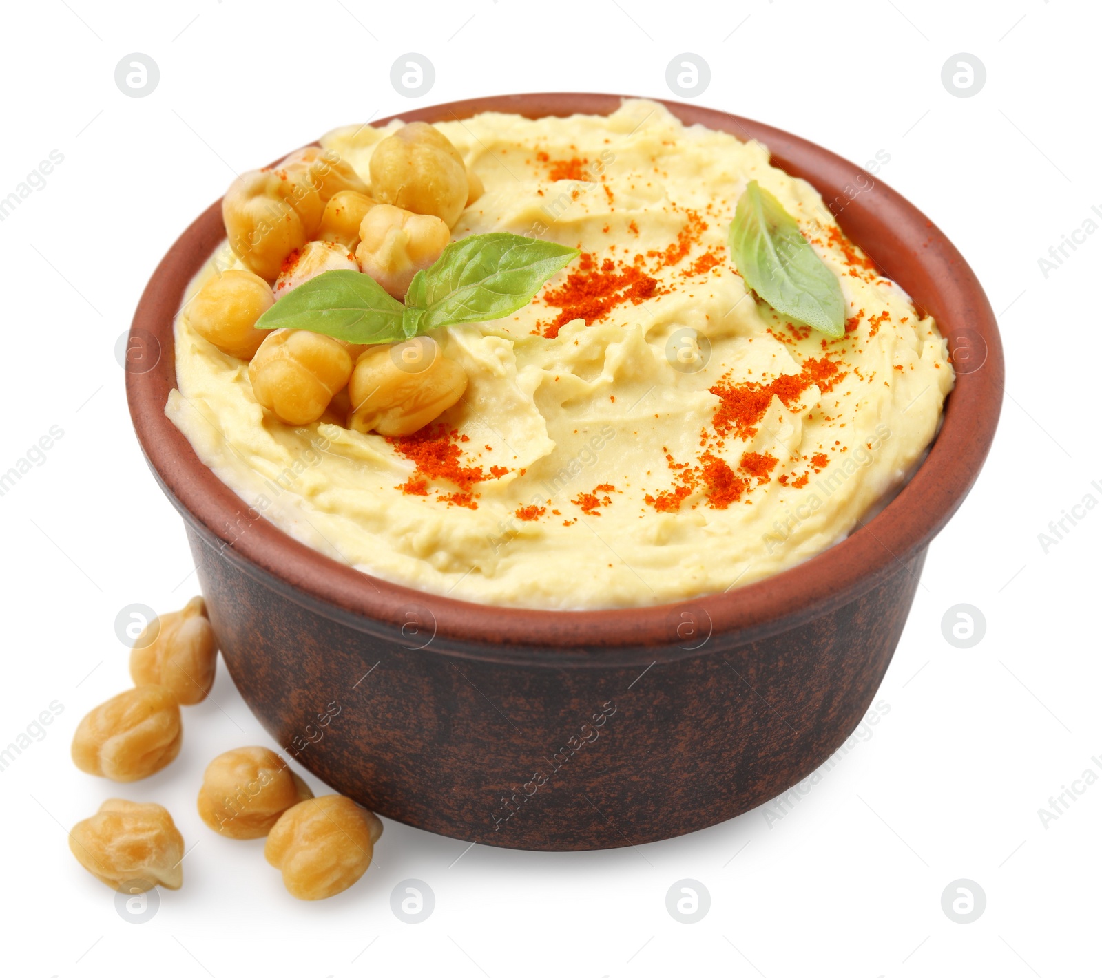 Photo of Bowl of delicious hummus with chickpeas and paprika on white background