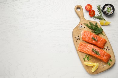 Photo of Fresh salmon and ingredients for marinade on white wooden table, top view. Space for text