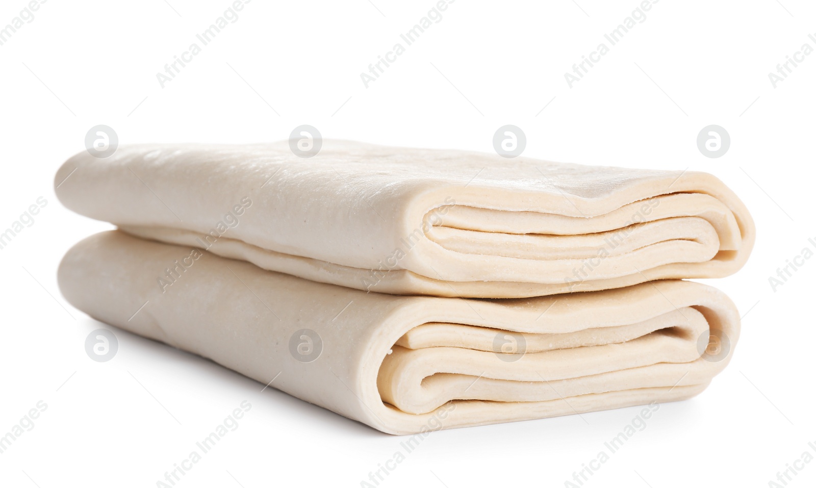 Photo of Fresh dough on white background. Puff pastry