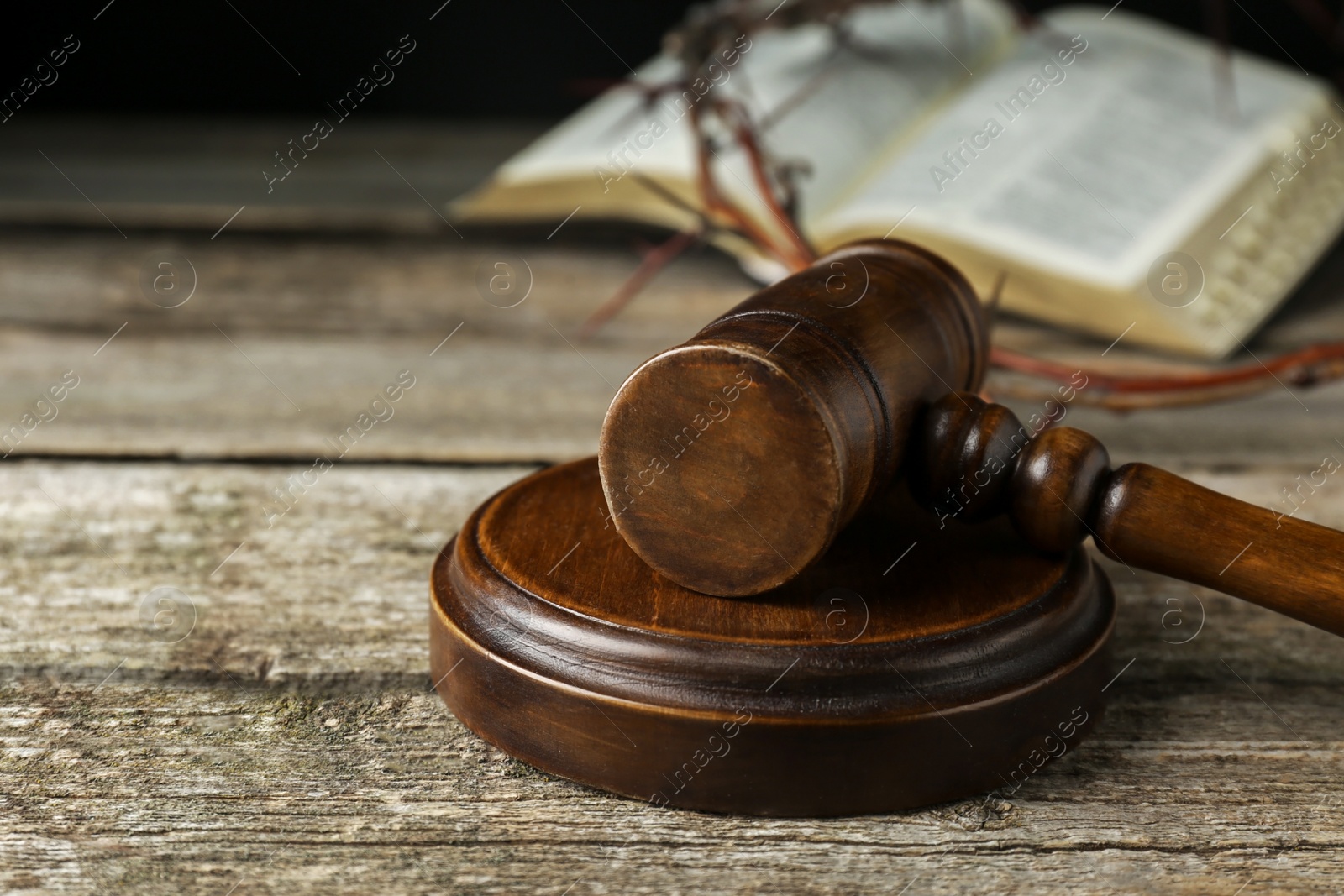 Photo of Judge gavel on old wooden table, closeup. Space for text
