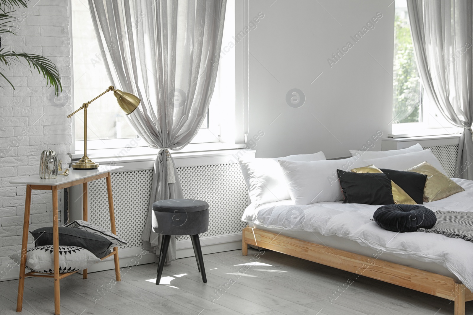 Photo of Stylish modern room interior with comfortable double bed