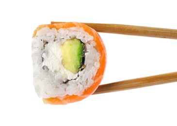 Photo of Chopsticks with delicious fresh sushi roll isolated on white