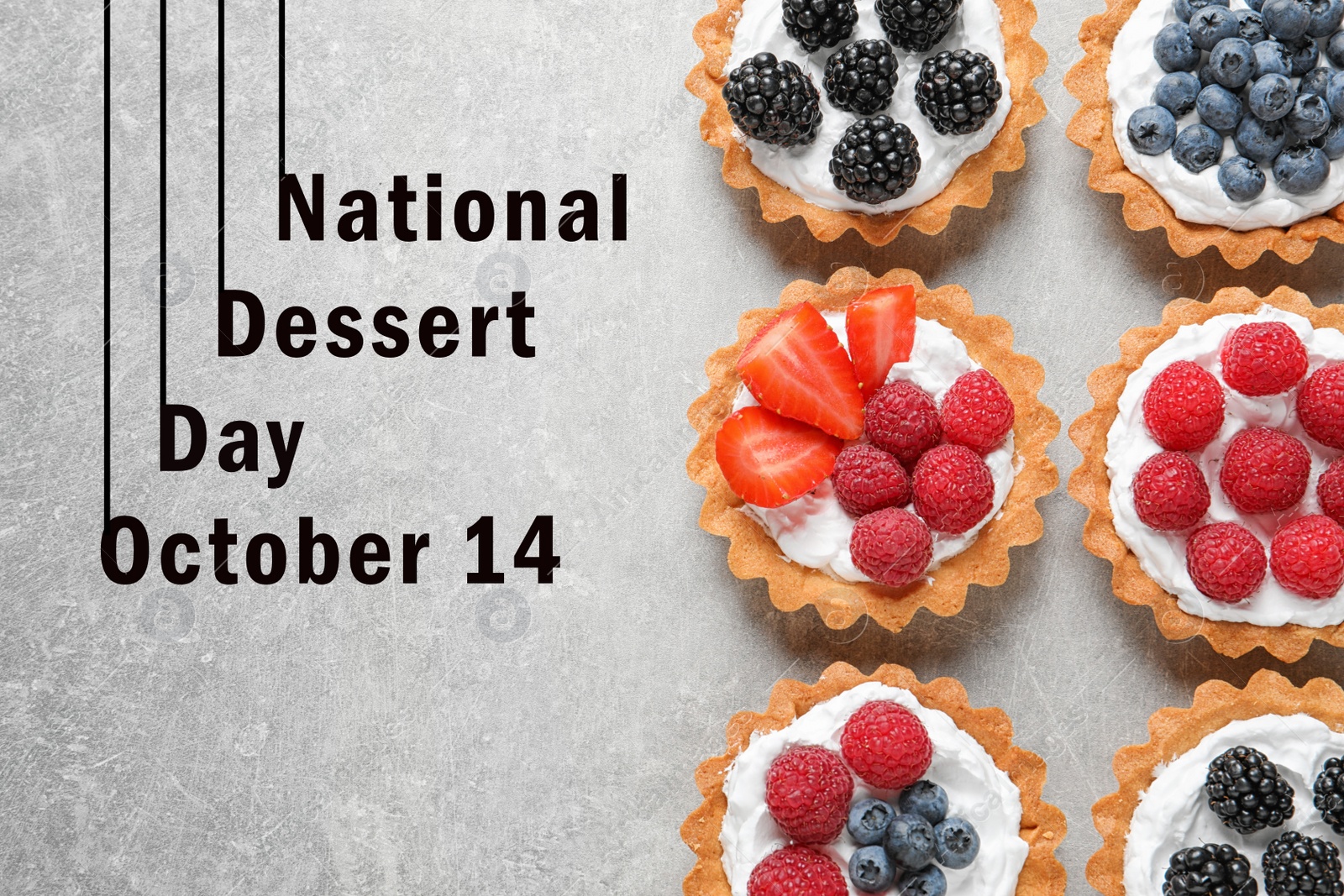 Image of National Dessert Day, October 14. Tasty tartlets with different fresh berries on light grey table, flat lay