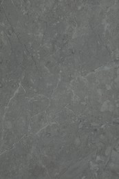 Photo of Texture of light grey marble surface as background, closeup