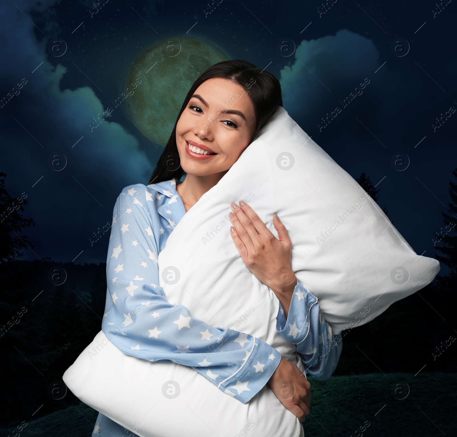 Image of Asian woman holding pillow, night starry sky with full moon on background. Bedtime