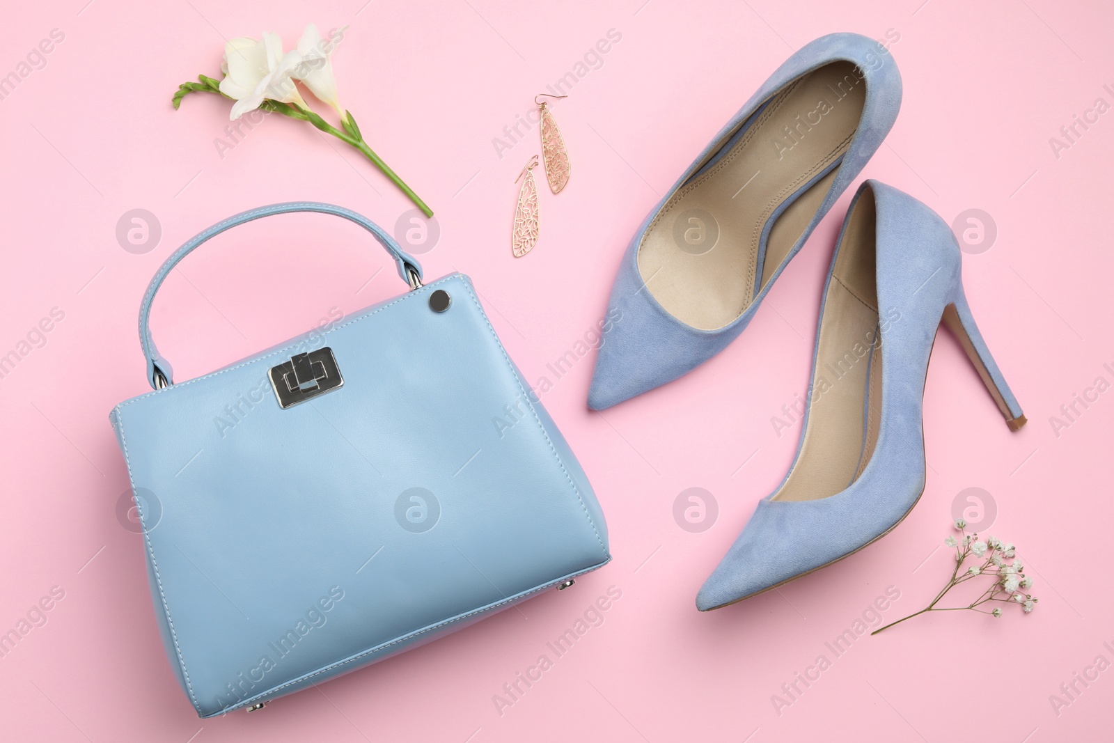 Photo of Flat lay composition with stylish woman's bag and accessories on pink background