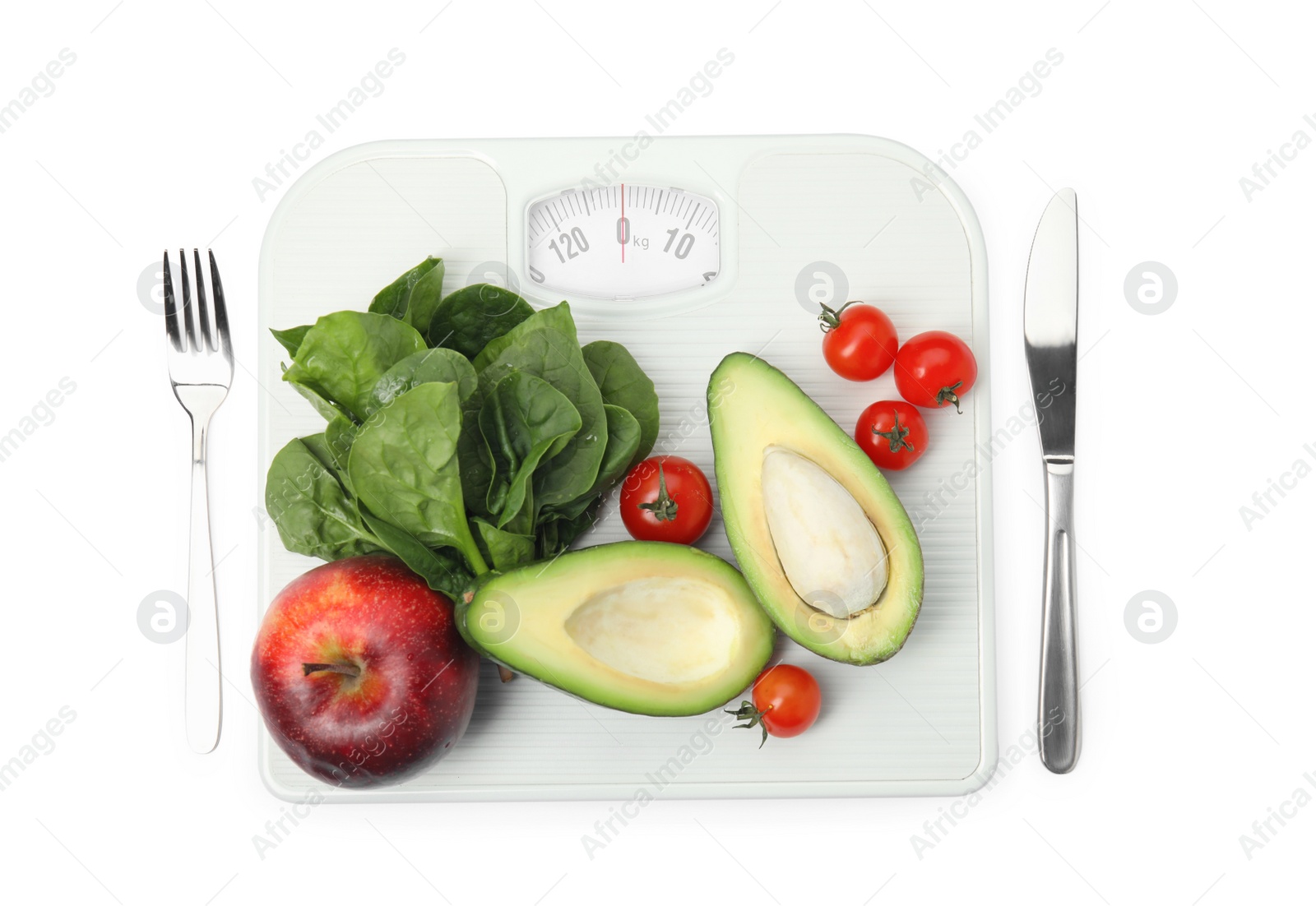 Scales, healthy food and cutlery on white background, top view Photo of Scales, healthy food and cutlery on white background, top view