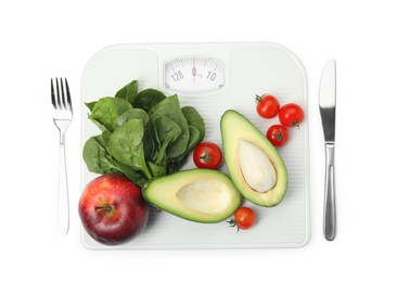 Photo of Scales, healthy food and cutlery on white background, top view