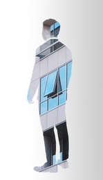 Double exposure of businessman and office building