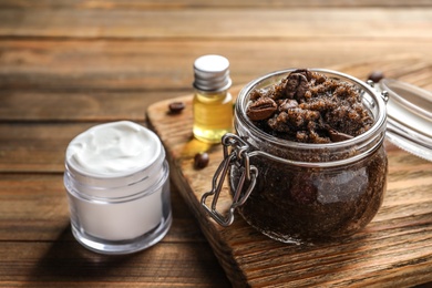 Photo of Glass jar of coffee scrub on wooden board