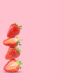 Image of Stack of fresh strawberries on pink background, space for text