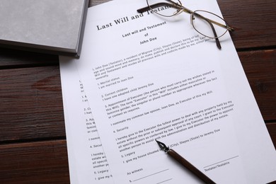 Photo of Last Will and Testament, glasses, pen and book on wooden table, flat lay