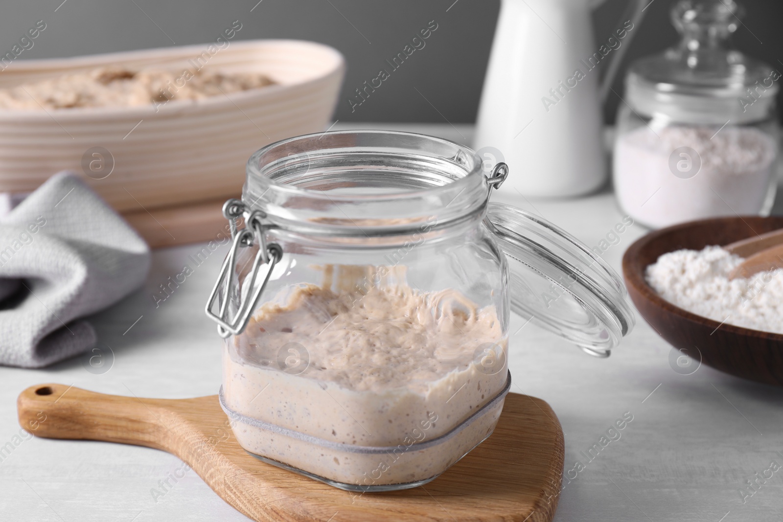 Photo of Sourdough starter in glass jar on light table