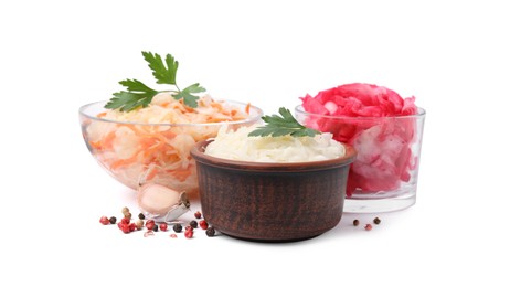 Photo of Delicious sauerkraut prepared according to different recipes and spices on white background