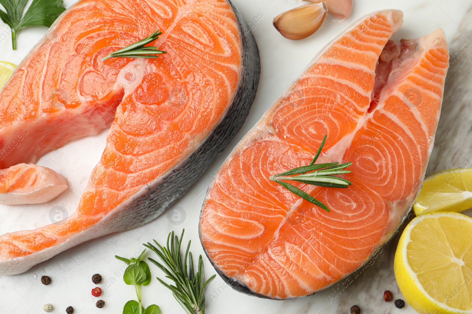 Photo of Fresh salmon and ingredients for marinade on table, flat lay