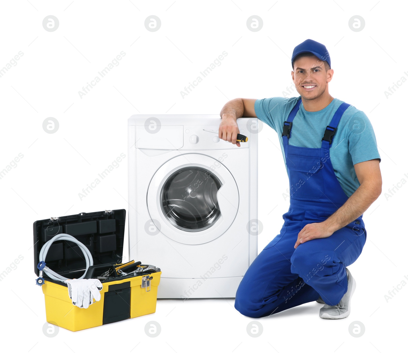 Photo of Repairman with toolbox near washing machine on white background