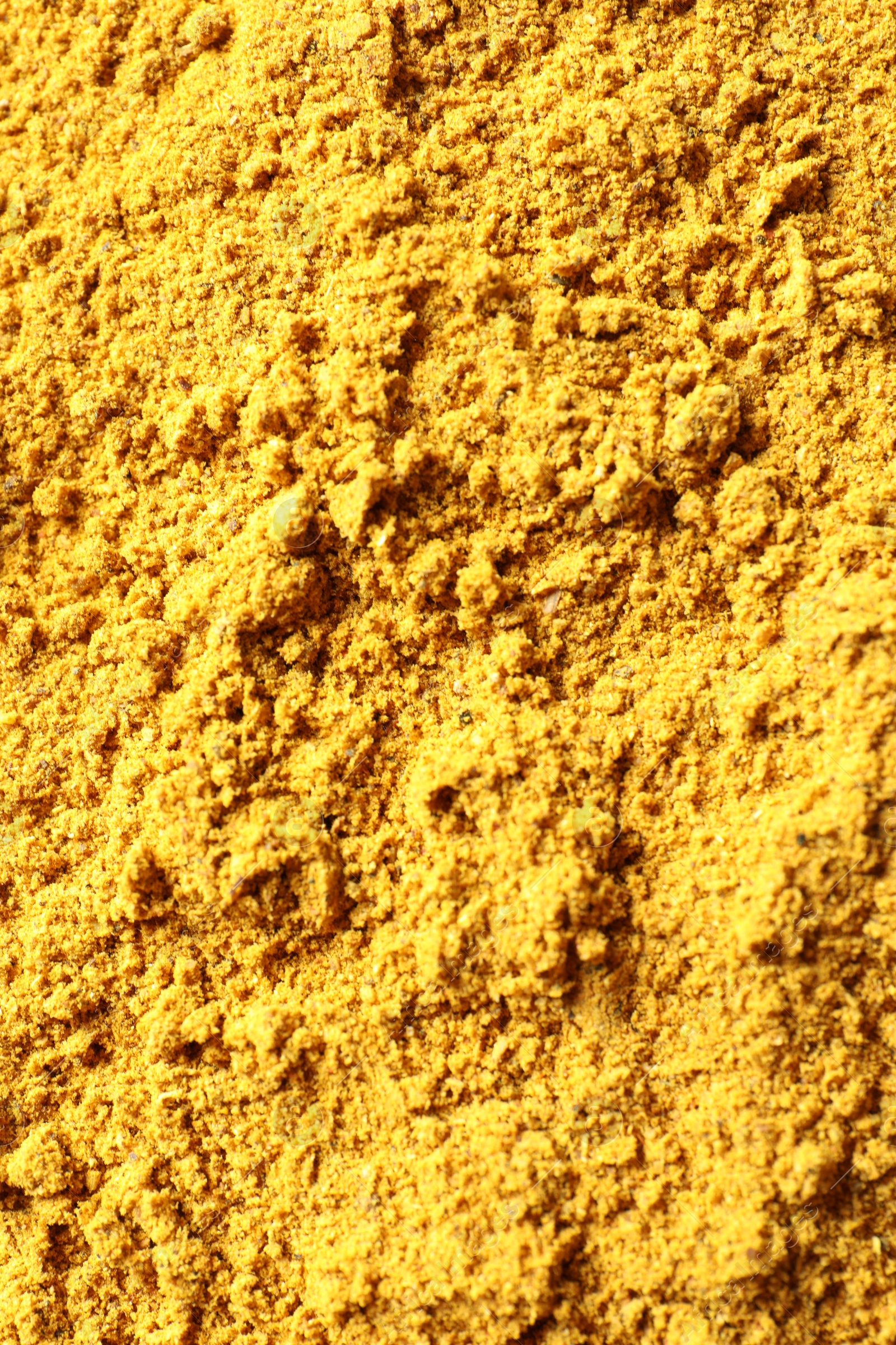 Photo of Dry curry powder as background, top view