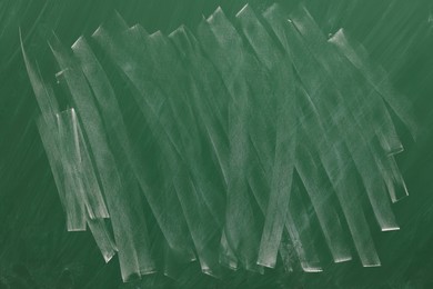 Dirty green chalkboard as background. School equipment