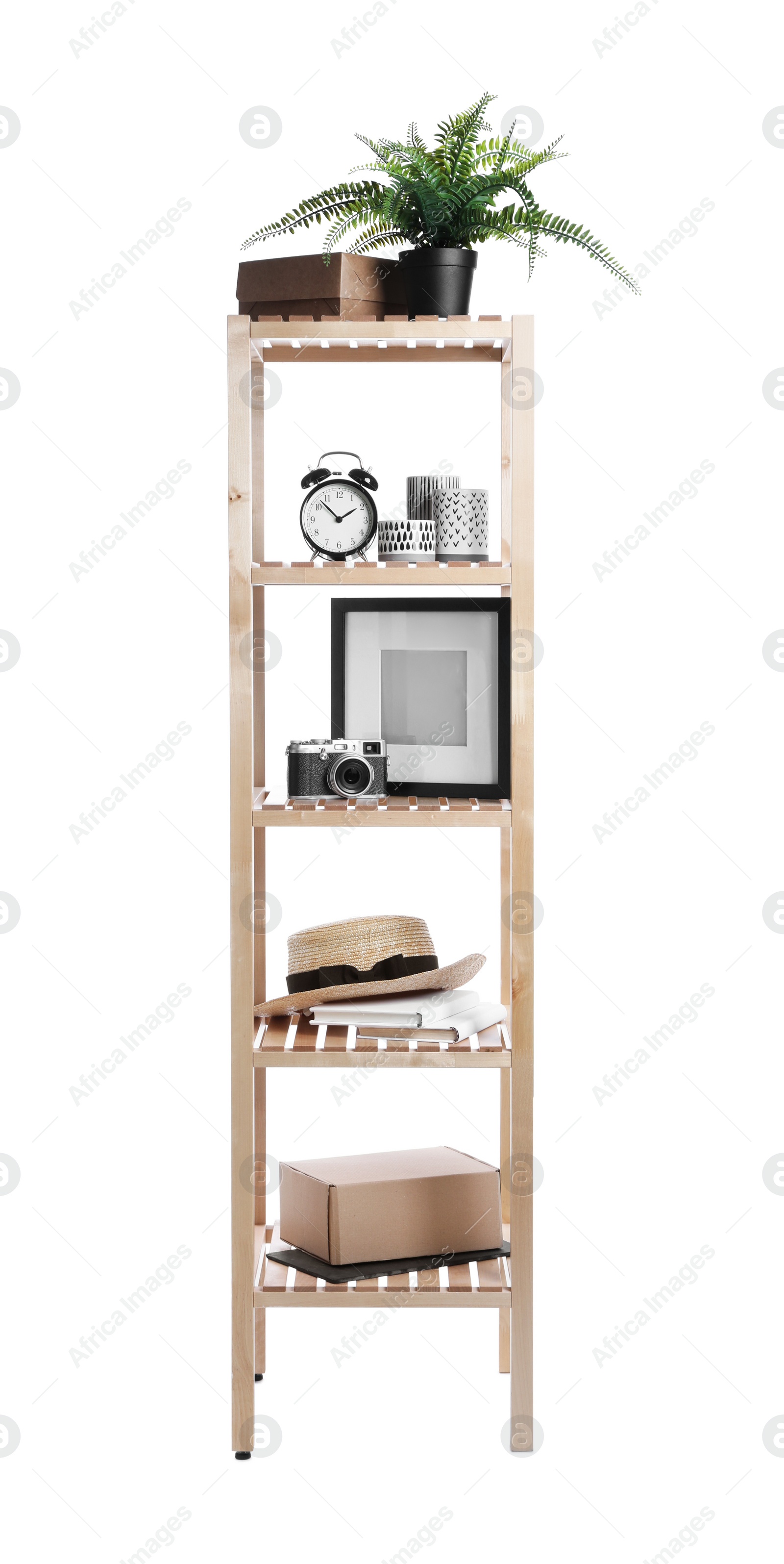 Photo of Wooden shelving unit with different items isolated on white