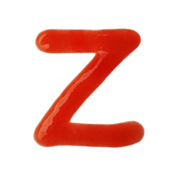 Letter Z written with red sauce on white background