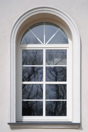 Photo of Beautiful arched window in building, view from outdoors