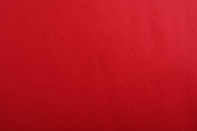 Photo of Abstract red background, top view. Colorful paper