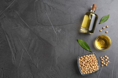Photo of Flat lay composition with soybean oil on grey table. Space for text
