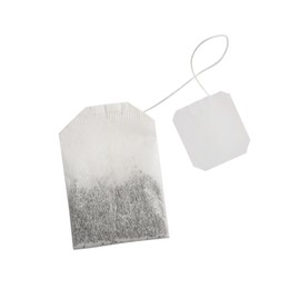Photo of Paper tea bag with tag isolated on white, top view