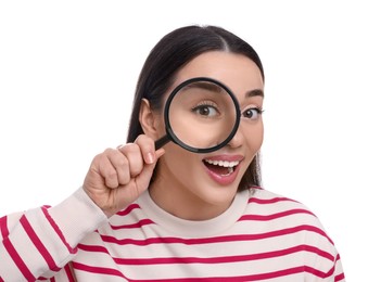 Photo of Happy young woman looking through magnifier glass on white background