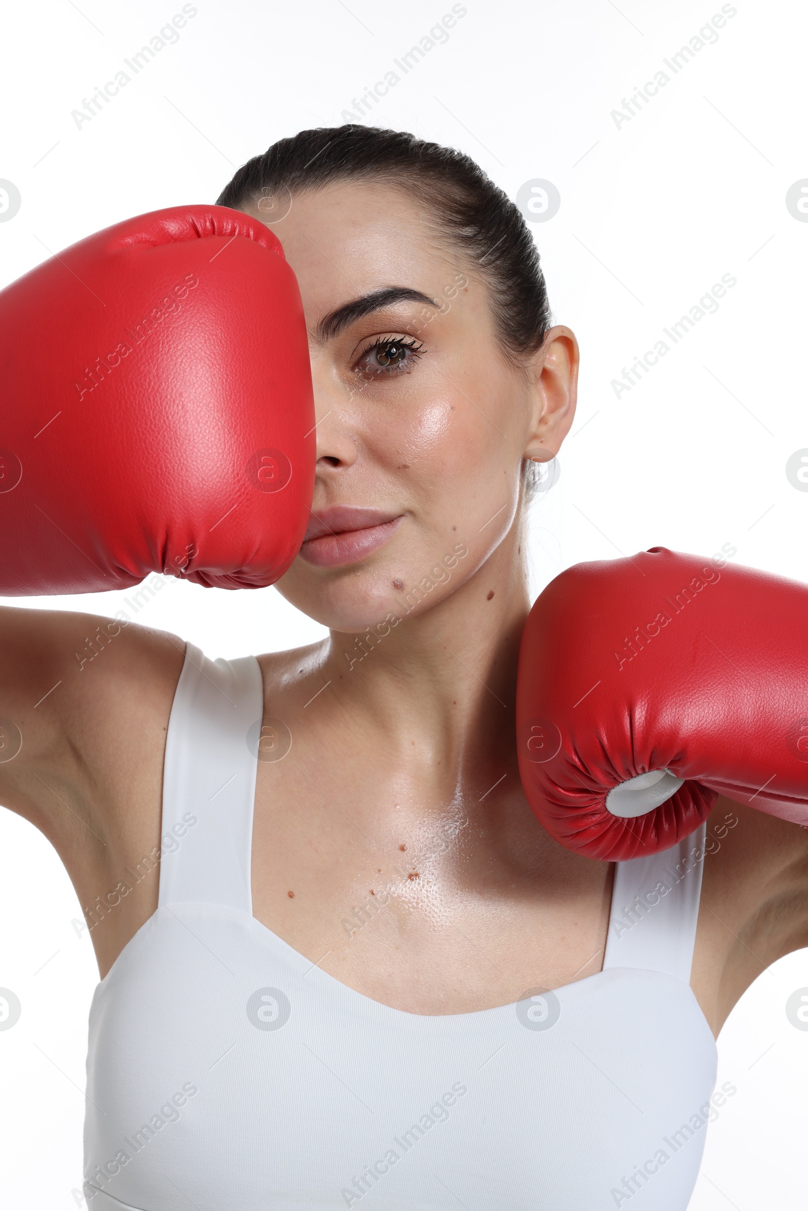 Photo of Beautiful woman in boxing gloves on white background