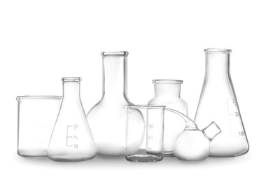 Photo of Clean empty laboratory glassware isolated on white