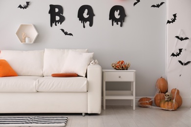 Photo of Stylish room interior with creative Halloween decor