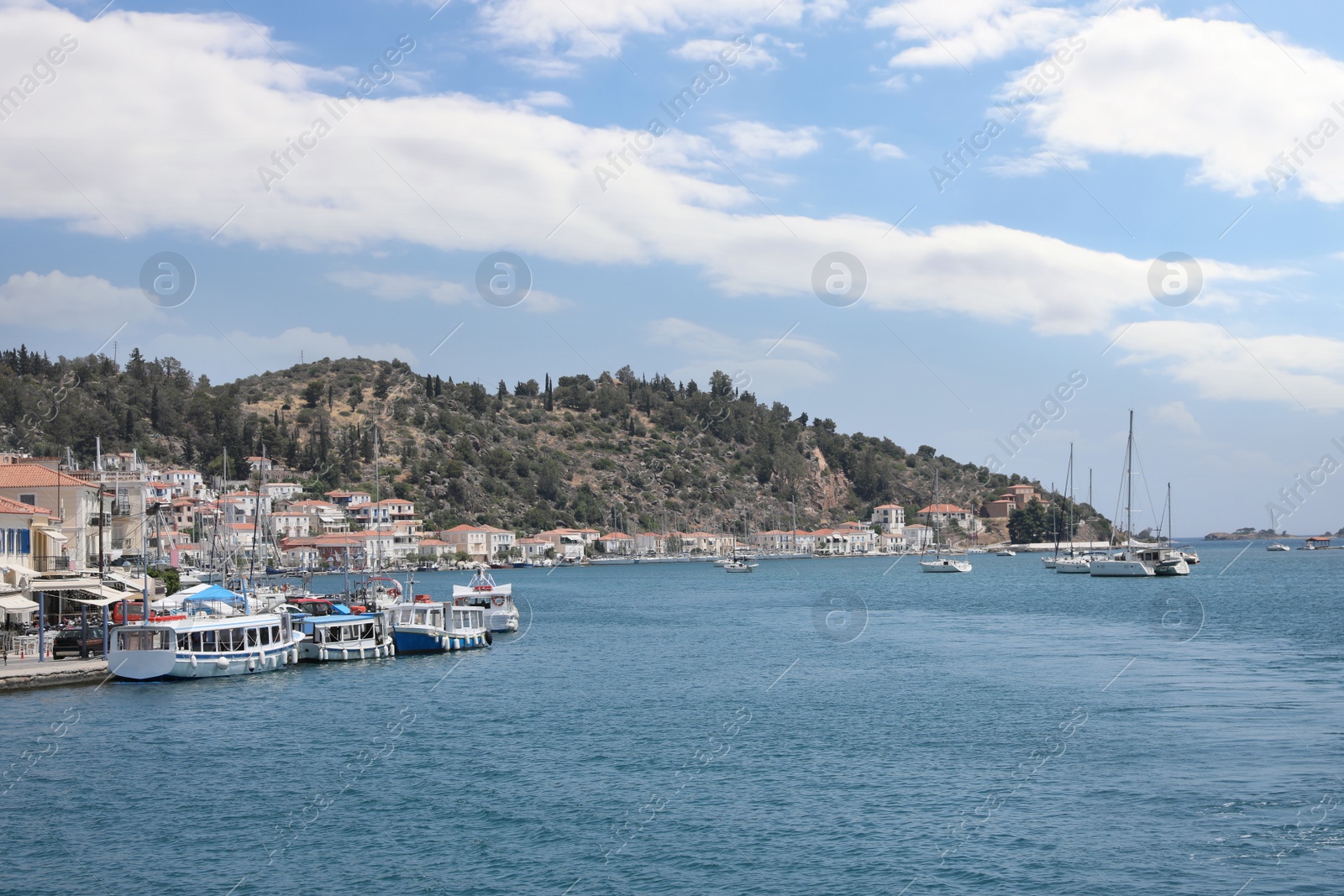 Photo of Beautiful view of coastal city with boats on sunny day