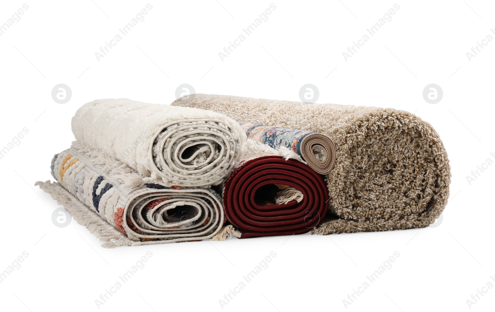 Photo of Rolled carpets on white background. Interior element