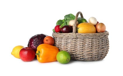 Photo of Wicker basket with fresh fruits and vegetables isolated on white