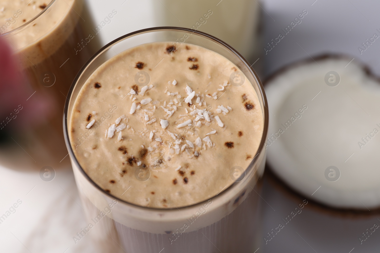 Photo of Delicious coffee with coconut syrup in glass, closeup