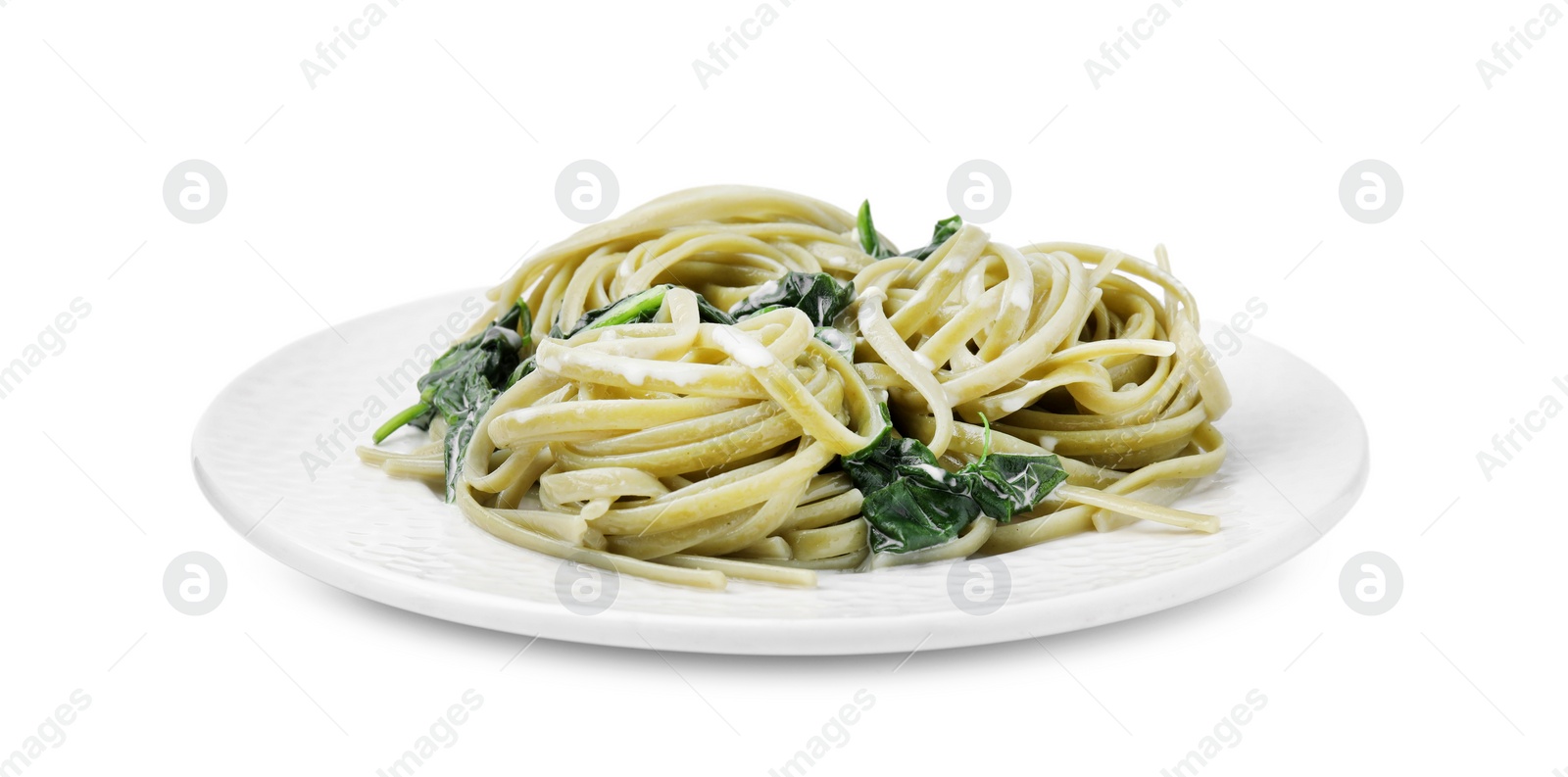 Photo of Tasty pasta with spinach and sauce isolated on white