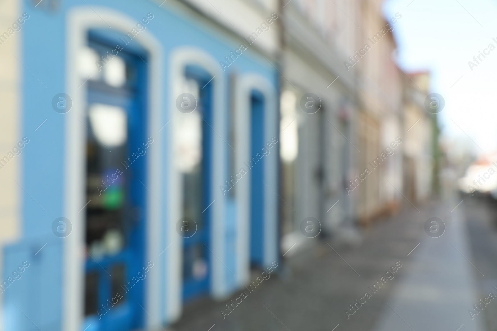Photo of Blurred view of city street with beautiful buildings. Bokeh effect